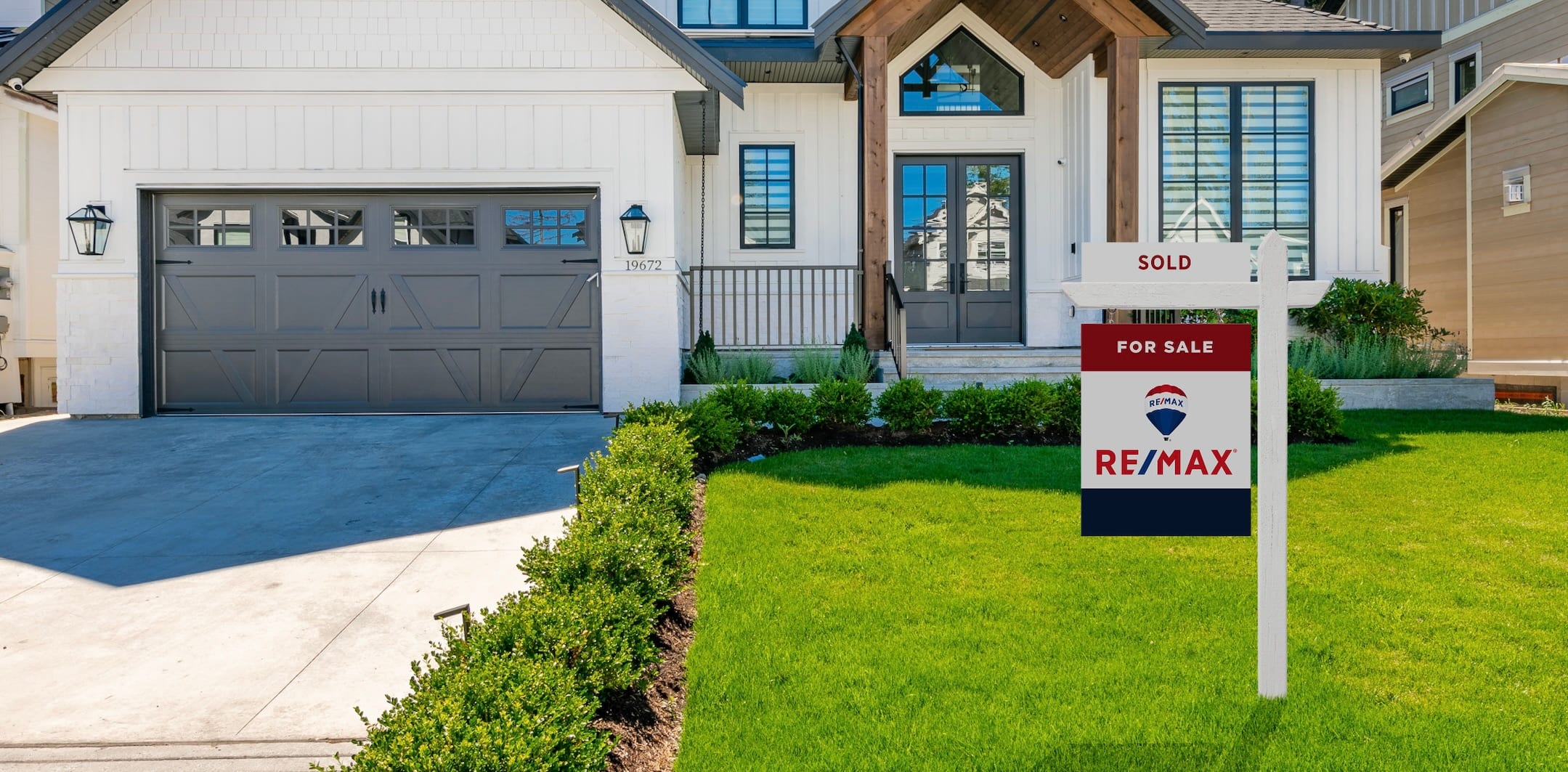 RE/MAX sign in a yard